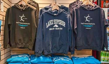 hoodies hanging in the Water’s Edge Mercantile and Gift Shop at the Resort