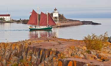 Boat sailing through Duluth in autumn