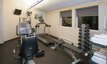 24 Hour Fitness Center has fitness treadmills, elliptical machine, free weights and a bench