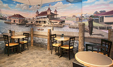photograph of Park Point Marina Inn Harbor's shore is on the wall of Cove Service Lounge