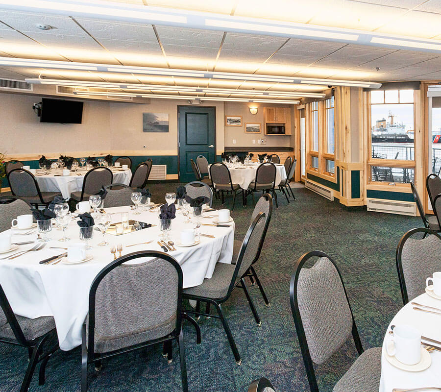 tables and chairs are well orderly place in the park point marina inn's meeting & banquet rooms 