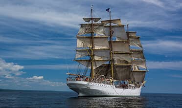 A tall ship sails close to Duluth